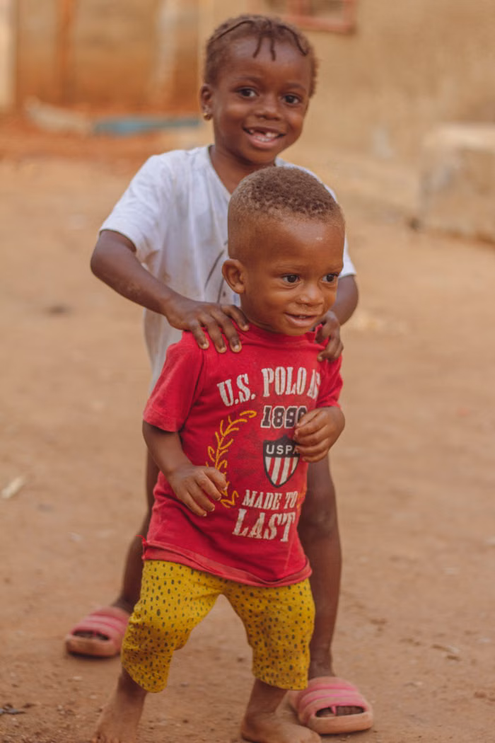 Children playing together outdoors in Nigeria