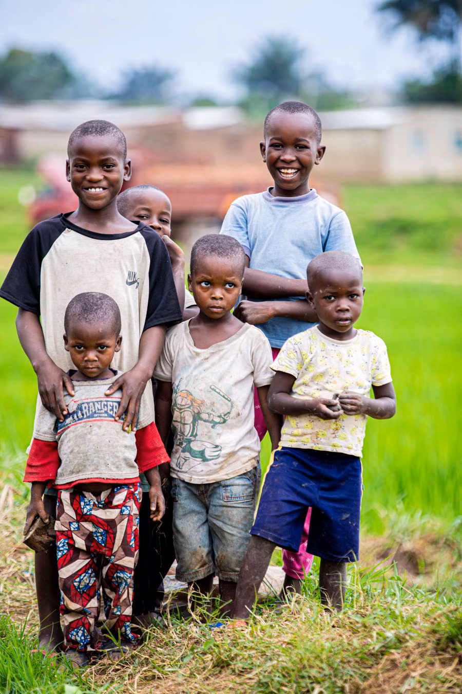 A group of children standing together outdoors, supported by the Safe and Seen community